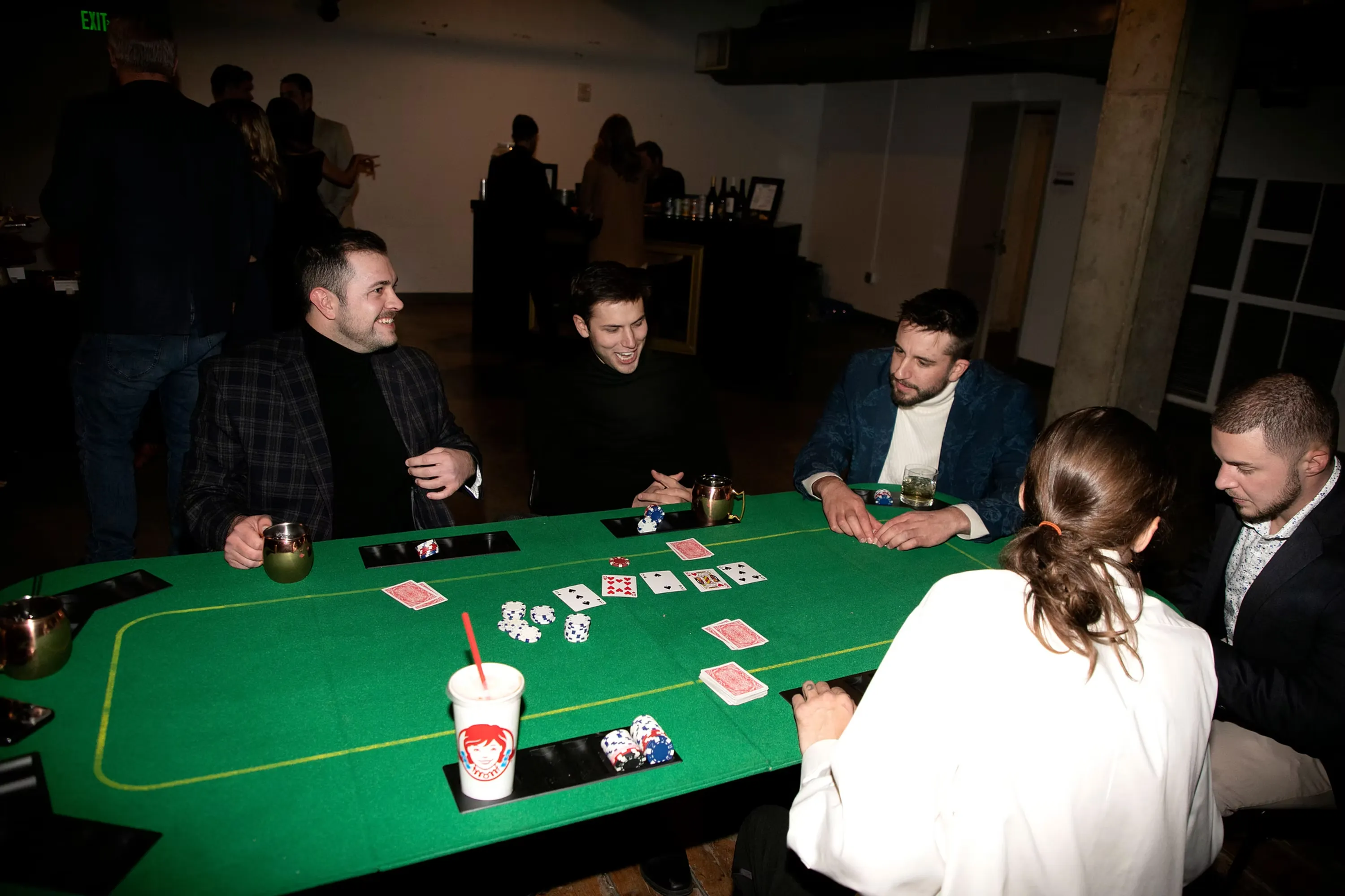 Guests enjoying casino party with blackjack table at Denver event