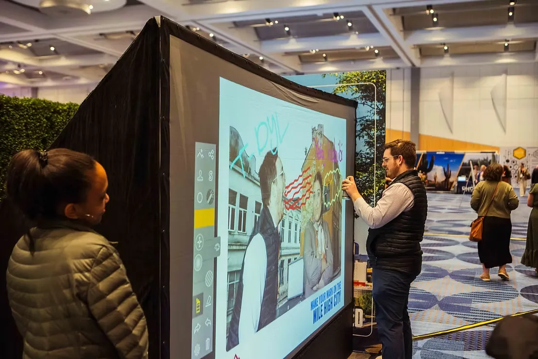 Interactive art photo booth with graffiti wall technology