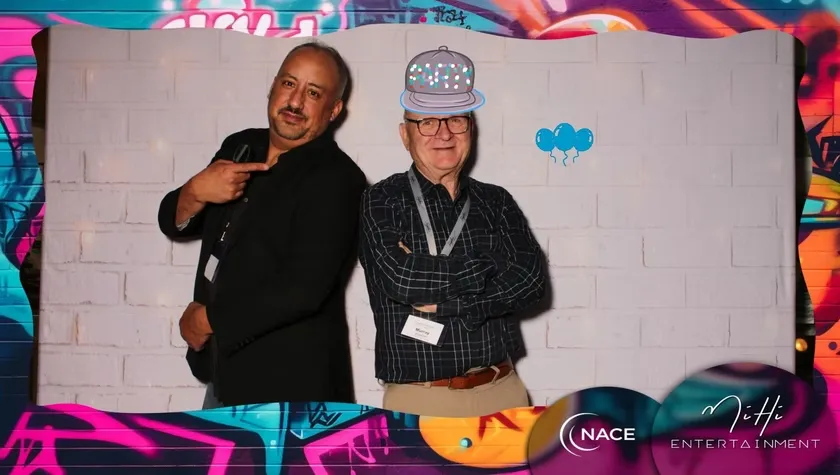 Branded graffiti wall photo booth with custom digital effects