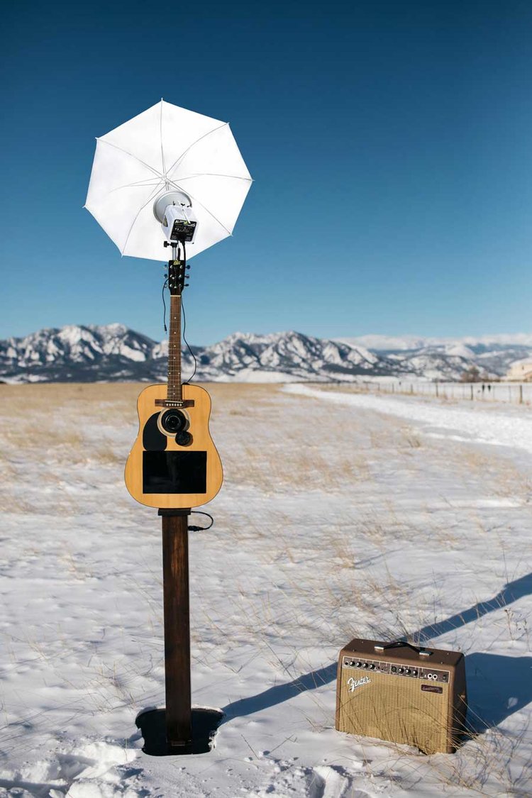 Guitar Photo Booth in outdoor setting with mountains in background