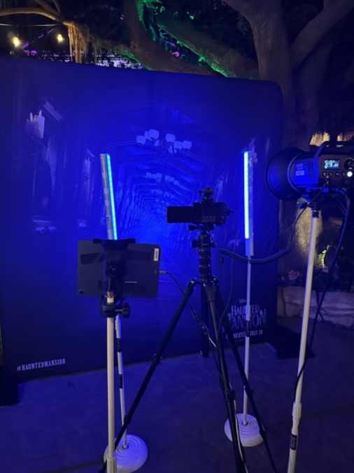 Haunted Mansion text with ghosts floating around