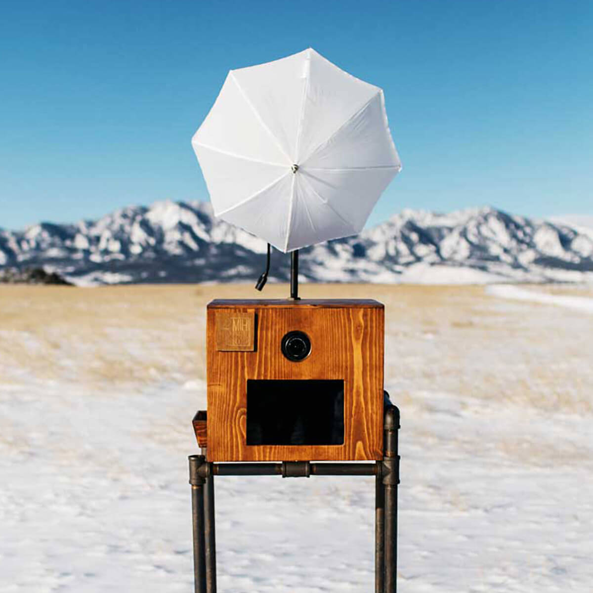 Rustic Photo Booth in outdoor setting with mountains in background
