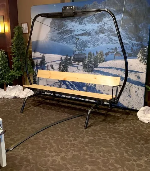 Après ski themed photo booth with cozy alpine escape design, snow-capped decor and lodge-style accents