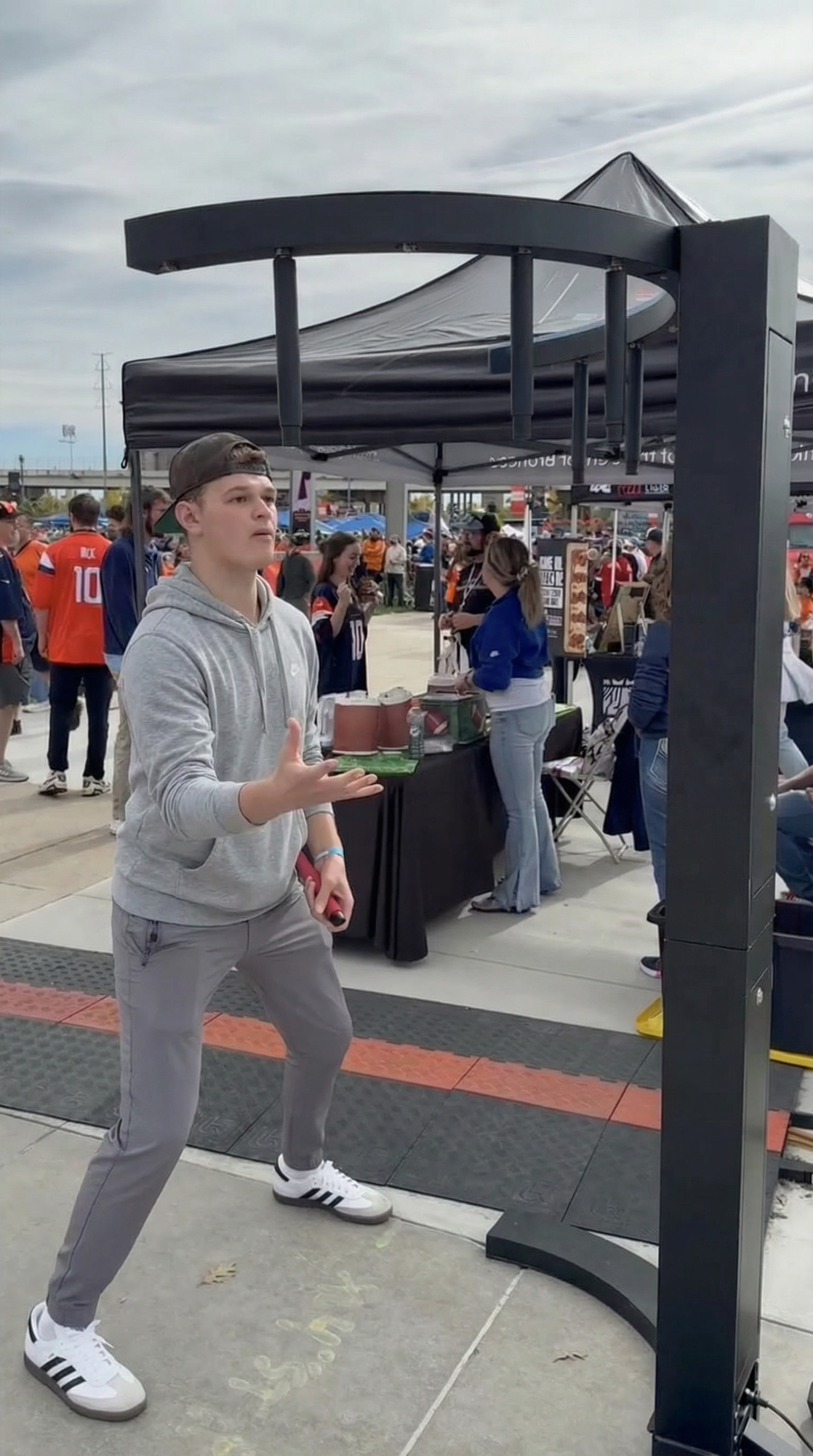 People playing Stick Drop Reaction Game at an indoor event